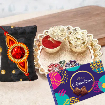 send fererro rocher, kaju katli, mixed flowers and dryfruits with rakhi to belgaum