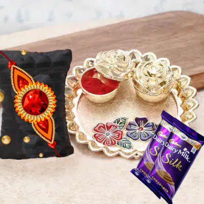 send fererro rocher, kaju katli, mixed flowers and dryfruits with rakhi to belgaum